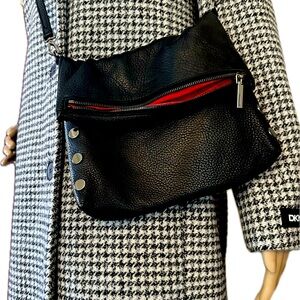 Hammitt small leather clutch with strap.